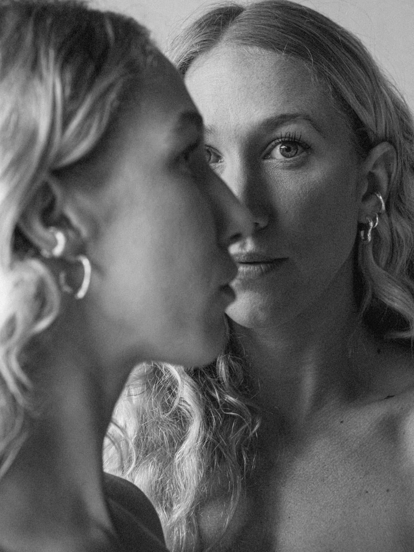 Styled shot of a model showcasing artisan silver hoops