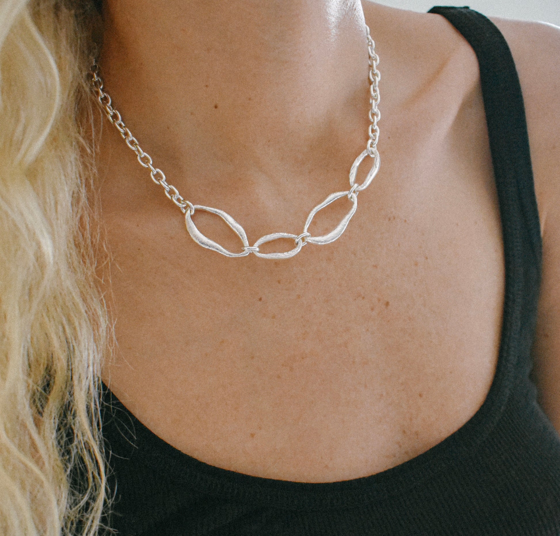 Sterling silver necklace with four organic links connected by a high quality cable chain. Modern architectural design