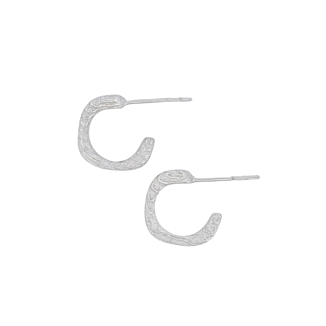 Product shot of cuttlefish cast earrings with beautiful texture