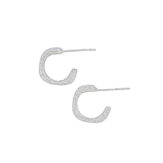 Product shot of cuttlefish cast earrings with beautiful texture
