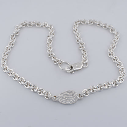 Close up of the tidal tab unisex sterling silver belcher chain necklace