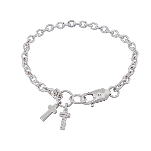 Sterling silver cable chain bracelet with two contrasting cross charms dangling from it